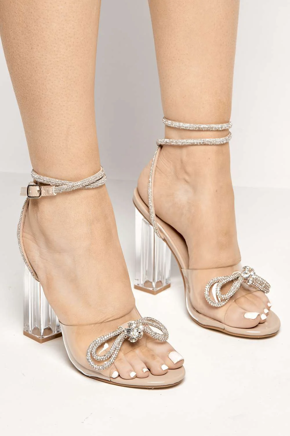 Joovie Diamante Bow Perspex Band Heeled Sandals in Nude Patent